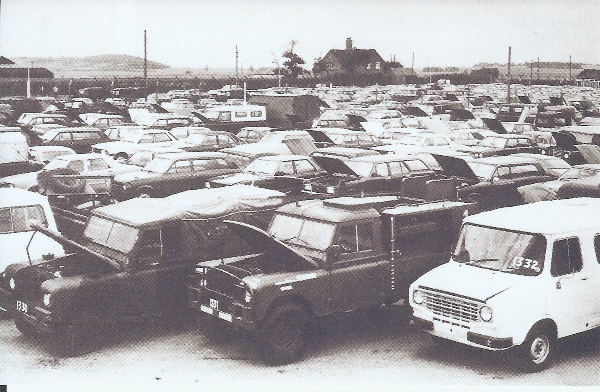 gallery/309.jpg = A vehicle park at the RAOC's disposal facility at Ruddington where Morris Minors were displayed prior to the auctions. (Battle of Britain Prints International Ltd)
